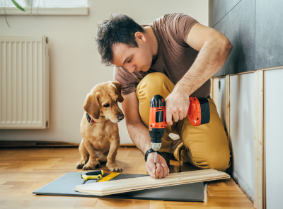 male with tools renovating house